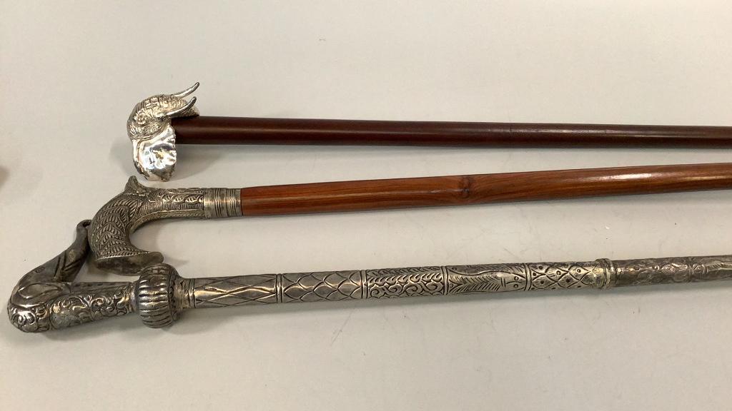 3 Gentleman’s Walking Canes: Sterling Elephant Head cane, 35 inches, Indian Hammered Cane with elephant head, sectional designs , hurled wood cane, 39 inches with a relief design handle