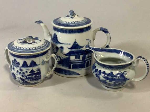 3 Pieces Asian Export Canton Porcelain: 7 inch tall tea or water pot with peach finial, covered sugar with double strap handles, berry finial, cream pot with long spout, all good condition