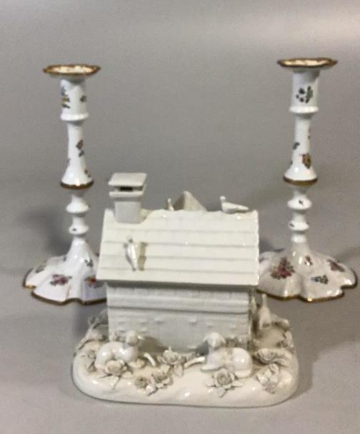 Mottahedeh Table Box, Pair Enameled Candlesticks: Glazed Bisque table box shaped as cottage with lift off lid, resting sheep, doves, florals, marked as Motteh and also Italy, pair 9 inch painted enamel candlesticks, floral ( some crazing to glaze on