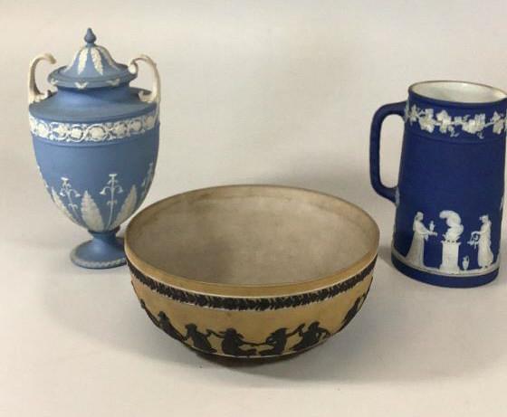 Wedgwood Jasperware Urn, Pitcher, Bowl: 9 inch bowl with dancing figures, basalt on a tan ground10 inch lidded urn, with classical decoration leaf, foliate and floral borders, 7.5 inch pitcher Wedgwood Blue, Classical figures surround the b
