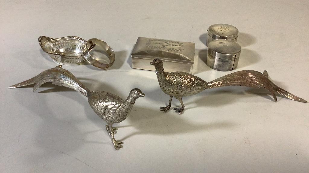 Sterling and Silver Plate Articles: Sterling nut dish, sterling napkin ring engraved Jeffrey, ? table box with hinged lid, chased design to lid, Pair 8 inch Pheasant shakers, , 2 plated stamp boxes