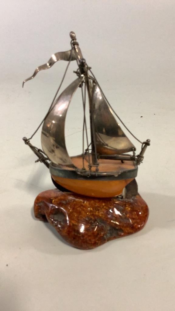 Unusual Amber and Silver Table Article,: 3 x 5 inch sailing vessel, body of boat and ocean "base" appear as amber, sails and rigging are marked 825,
