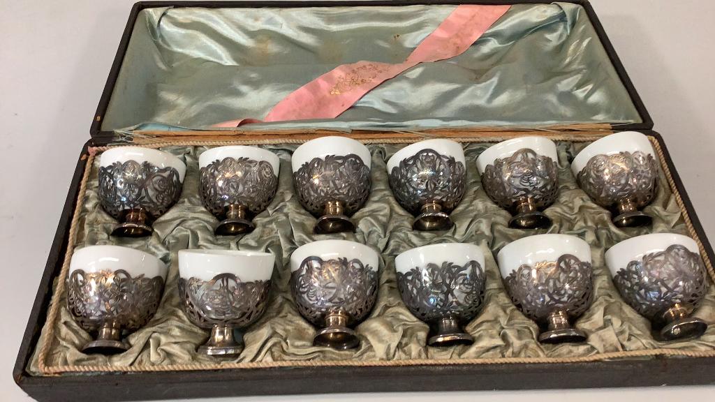 Set of 12 Antique Porcelain and Silver Egg Cups: 2.5 inch set includes a white porcelain cup with a filigree silver holder, each stamped with a Tugra, or Turkish Sultans mark,