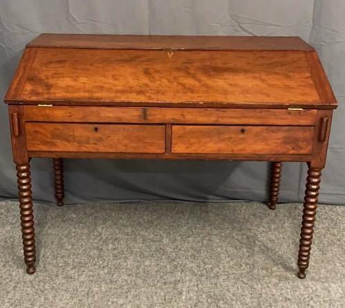 Cherry Schoolmasters Desk: The slant top opening to reveal a fitted interior, with Jenny Lind legs and desk blocks. Very good condition, replaced hinges all locking hardware is original. 36 inches tall x 4 inches wide x 27 inch