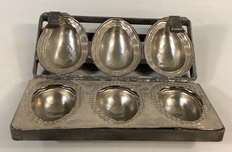 Three Egg Candy Mold: 11 x 5 inch mold for 3 identical eggs, each with wavy icing trims, center separator plate, each egg form is 4.5 inches, good condition Line Item # 34