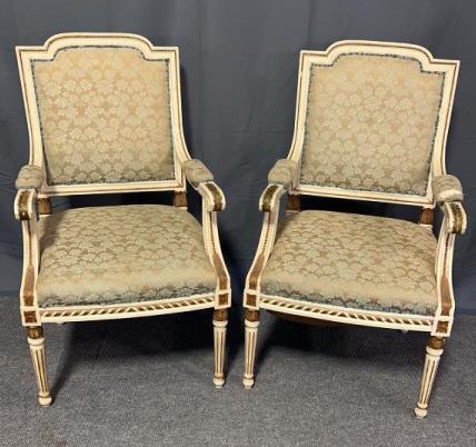 Pair Louie XVI Open Armchairs: Newer paint, seats have been replaced and upholstered, upholstery is clean, one arm Cushion needs repair, fluted legs, acanthus carving, gold painted trim, sturdy