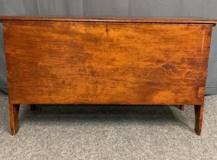New England 6 Board Blanket Box: . Early 19th century. The rustic blanket chest is raised on plank legs with pegged construction throughout. Has key and has been refinished