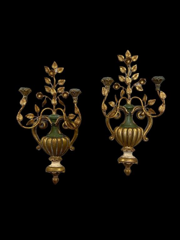 Pair of Palladio Giltwood and Metal Sconces: Urn form with scrolling metal candle holders and flowers. Original colors with beautiful patina. Made in Italy and Palladio tag on back. Minor repair, see photo. 23H x 11W. Candle holders with tacky r