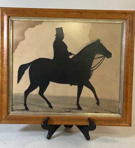 Antique Silhouette Horse and Rider: 16 x 14 inch sight, Gentleman in a top hat holding a riding crop, mounted in a maple frame