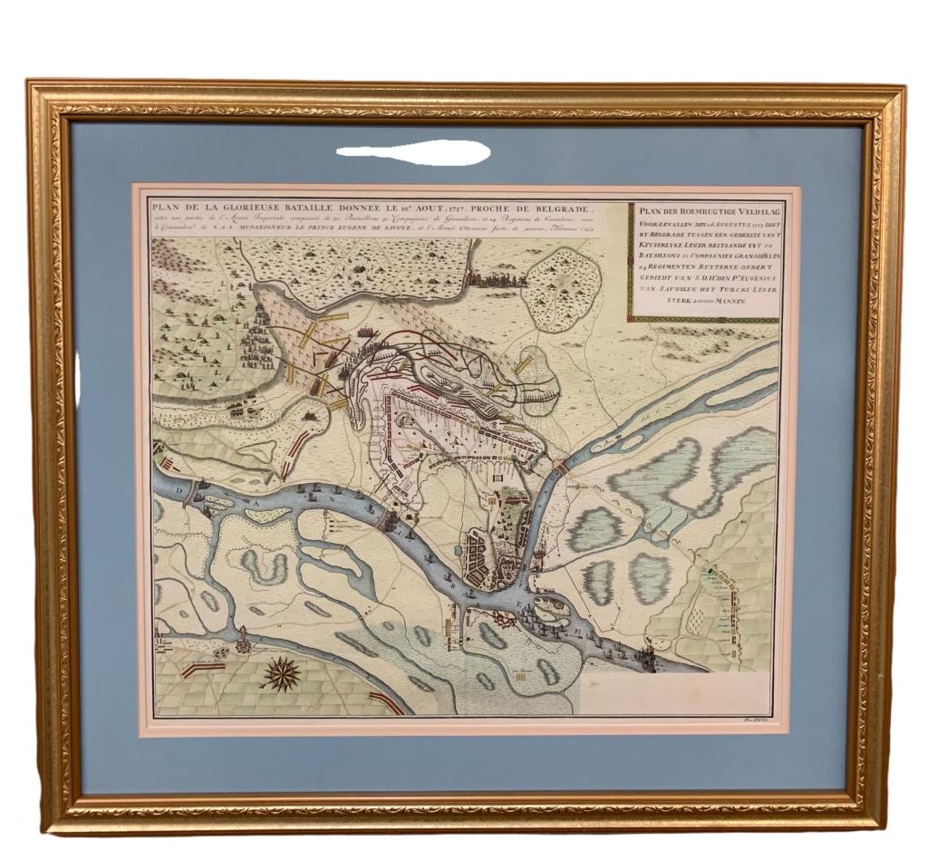 Map of the Siege of Belgrade: On laid paper, hand colored. Vertical center crease. Partially obscured maker info lower right. Foxing and toning present. Double matte under glass, gold tone frame. Map measures 18H x 22W. Not examin