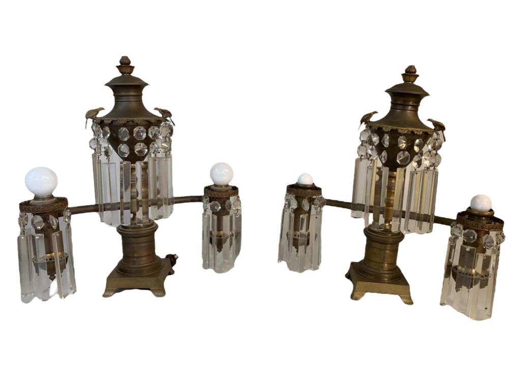 Pair of Victorian Brass Luster Lamps: Grand brass 2-light lamps with hanging lusters, central luster ring adorned with birds, floral finial, 19H x 17W, missing 4 lusters, no shades, both tested and work, original wiring