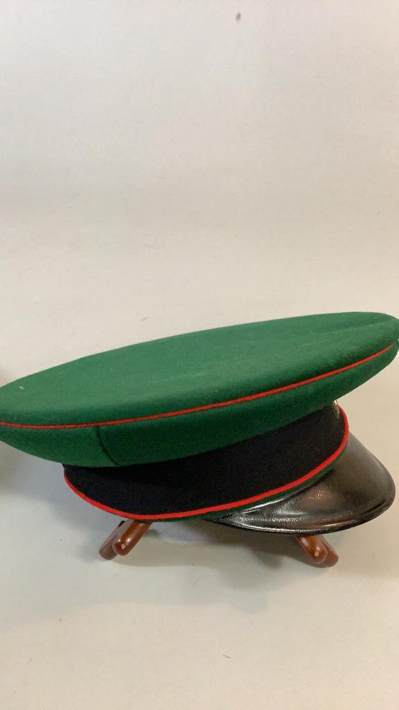 Two WWI Imperial German Visor Hats: Felt Visor Caps1- black felt with red band, double kokarde, leather visor bill , stamped interior J. Ullrich 2- green felt with red and black, double kokarde, top w/ red center, leather visor bill, ca
