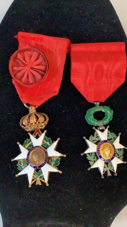 2 French Legion Of Honor Medals: Both with enameled 5 point stars, gold tone under crown officer’s medal, 1870 with circular wreath , light wear to remaining ribbon