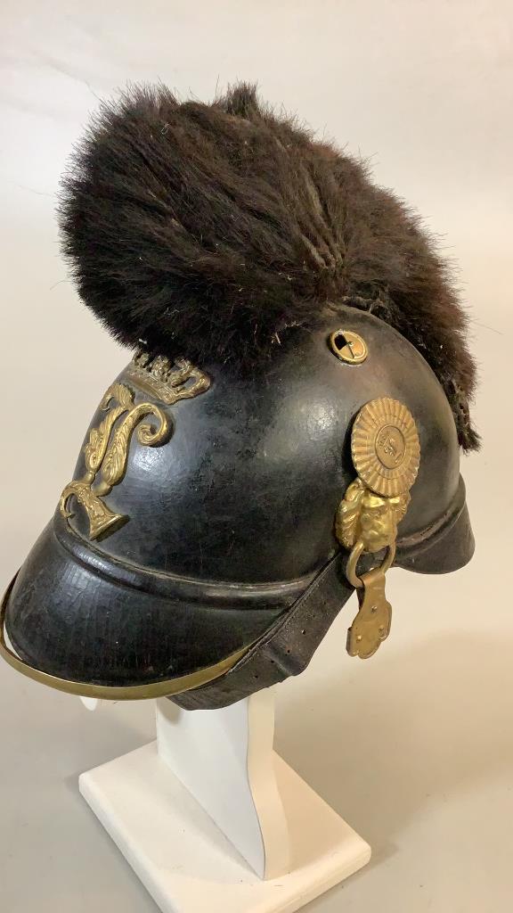 French Military Helmet: Leather with brass trims, leather chin guard, Lion head rings, crown with L, fur topper * some losses