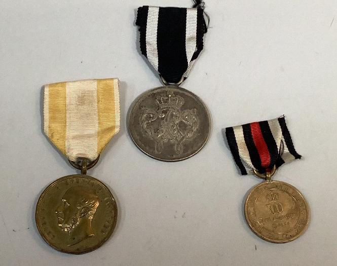 Three Prussia Military Medals: 1. George V King of Hanover Battle 1866, Merit With ribbon, 2- Prussia Warriors Merit, pre WWI, bears Cypher of Wilhelmina III, w/wreath of laurel on reverse, w/ ribbon, 3-Bronze Combat Service Campai