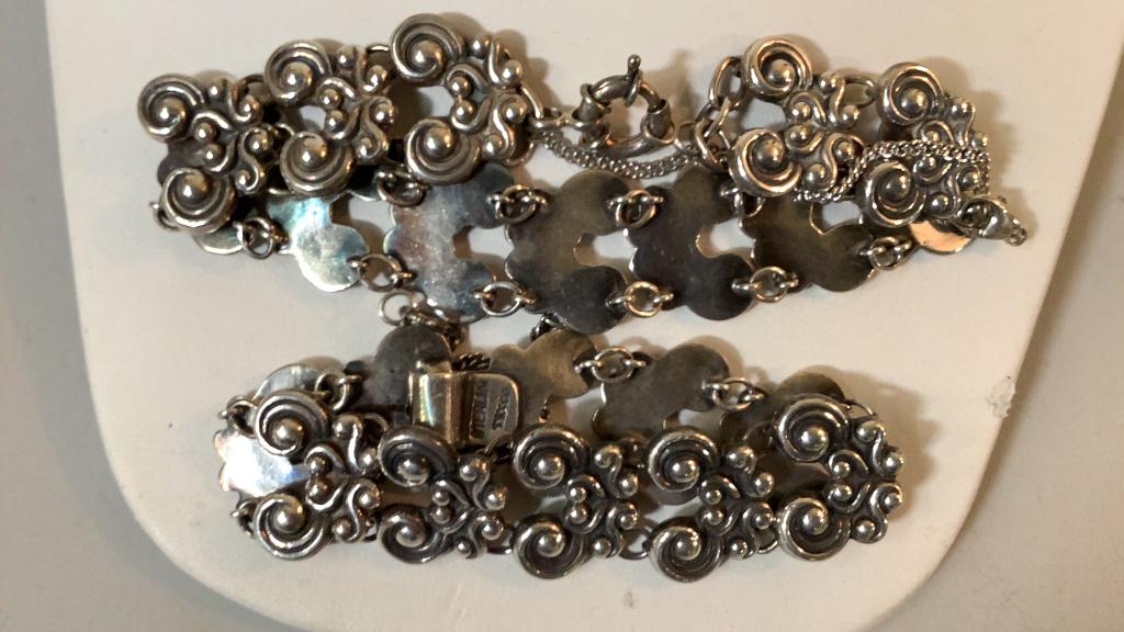 2 Silver Bracelets: Both carry same design, repeating links, one stamped Sterling and Taxco, one with lobster clasp and safty chain, unmarked