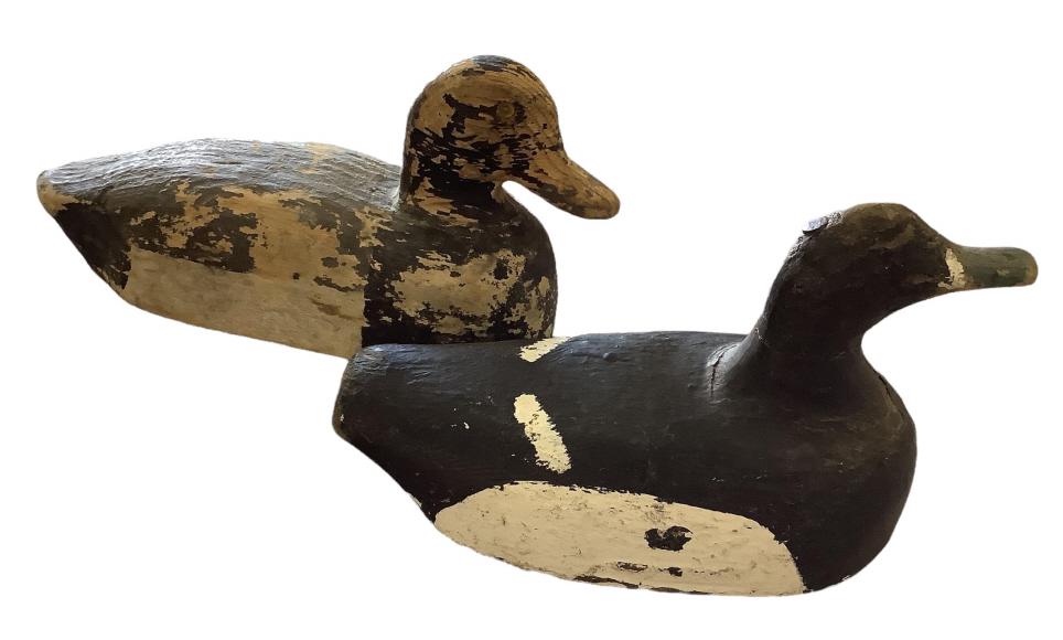 2 Primitive Antique Decoys: 12 inch decoy, glass eyes, stamped weight #58, 10 inch decoy hand painted in white and black, blue bill, lead weight at back