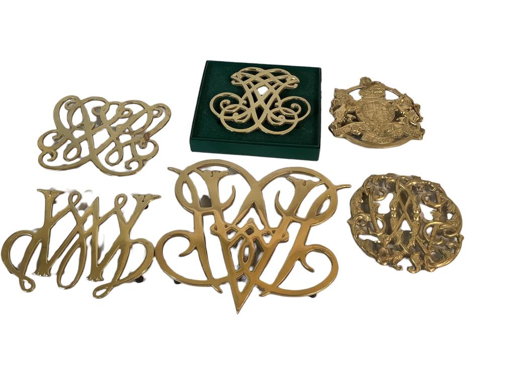 Six Brass Trivets, Colonial Williamsburg: Virginia Metalcrafters ..includes Thomas Jefferson, Queen Anne, William and Mary ciphers, as well as Williamsburgs