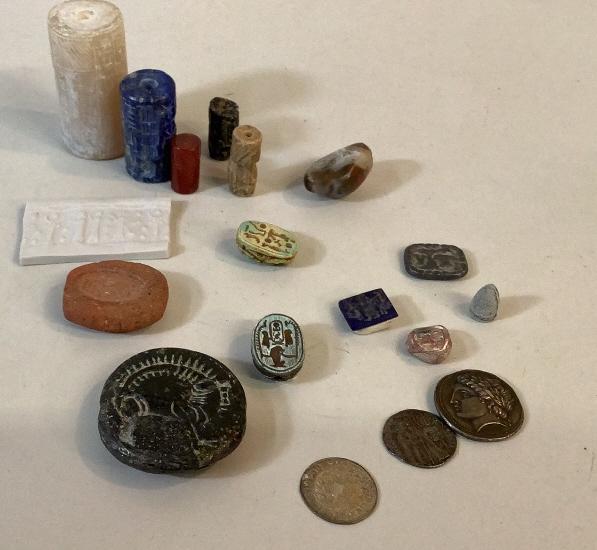 Collection of Relics, Coins, Oddities: Steatite Stamp Seal, Bearded Ibex, small scarab, Amphitheater ticket slug, ClaySeal, Egypt, Scarab Seal, 6 carved cylinder disk,