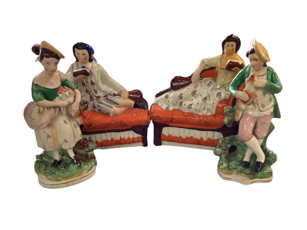 2 Pair Staffordshire Figurals: 1- 7 x 8 inches, Man and Woman reclining and reading, w/ repairs 2-9 inch figure man and woman each holding pets, solid base, light paint flaking