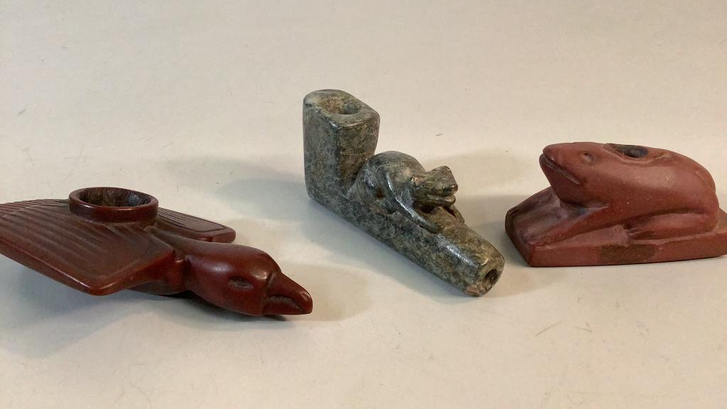 Three Stone Effigy Pipes: 1- Greenstone animal effigy 3 inches, frog form In pipestone, 3 inches, Sioux Thunderbird pipe in catlinite, 4.5 inches