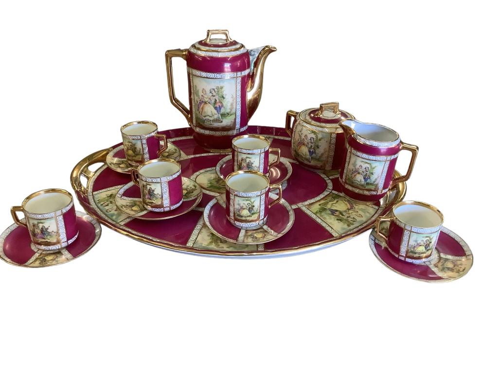 Royal Vienna Table Service: 16 piece set, 15 inch oval tray, 6 cups/ saucers, cream pot, covered sugar, Deep plum with gilt and panel decoration