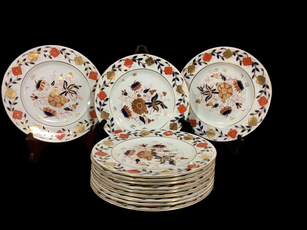 Set 12 Royal Crown Derby for Tiffany and Company: 11 inch plates, Imari pattern with bold colors on ivory ground, stamped, * service has been used with light normal wear