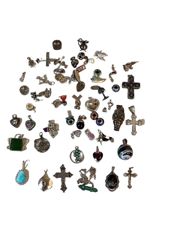Collection Sterling Charms, Pendants: Crosses, varied stones, Santa, Pandora beads, Airplane, bell, spider, hearts, Angel, skull, Christmas Tree, many others. Marked or tested sterling * stones not tested