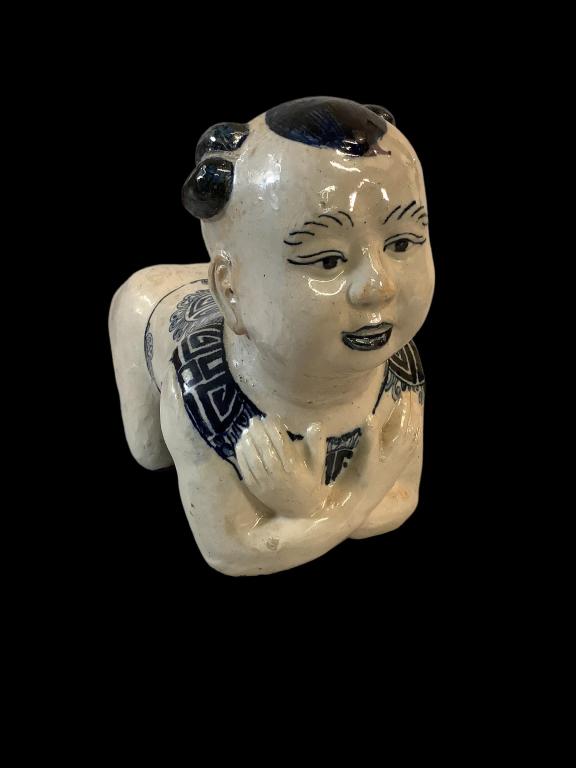Asian Porcelain Figural Opium Pillow: 9.5 x 14 inches, she has crossed arms painted features in blue, heavy