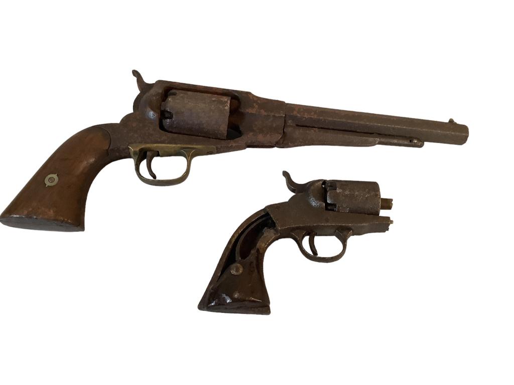 2 Pistols: Possibly Remington Army model, six shot revolver, 13 3/4 inches long, obscured w/ Pitt marking, and a Bacon revolver remnant, reputed to have been found at Antietam Creek