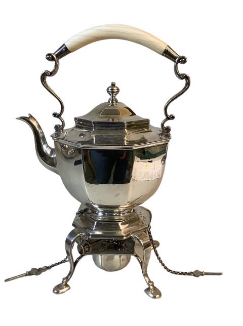Edwardian Sterling Silver Tilting Kettle: 14.5 inches includes base, with nicely curved bone handle, warmer base, mark of Thomas Bradbury and Sons, 1907, and Lion Passant hallmark, double stamped to kettle and base, securing pins chain attach
