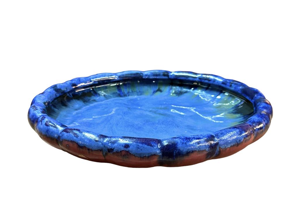 Large Fulper Art Pottery Center Bowl: Blue and purple glaze, scalloped rim, rectangular mark on bottom..firing imperfections but no chips, cracks or repairs present..15.5 inch diameter, 3 inches tall. Line Item # 60