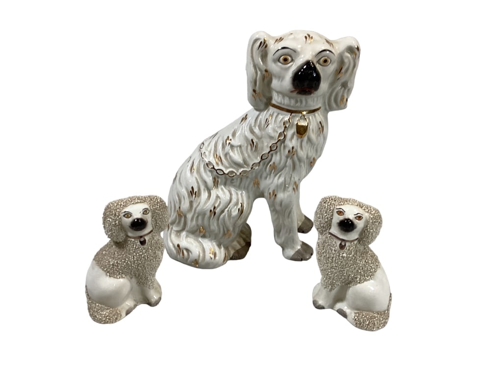 3 Staffordshire Dogs: Pair 4.5 inch right and left facing spaniels, gold chain collars, painted features, curly fur, single 10 inch left facing spaniel, chain collar, an$ gilt decorated body.* crack