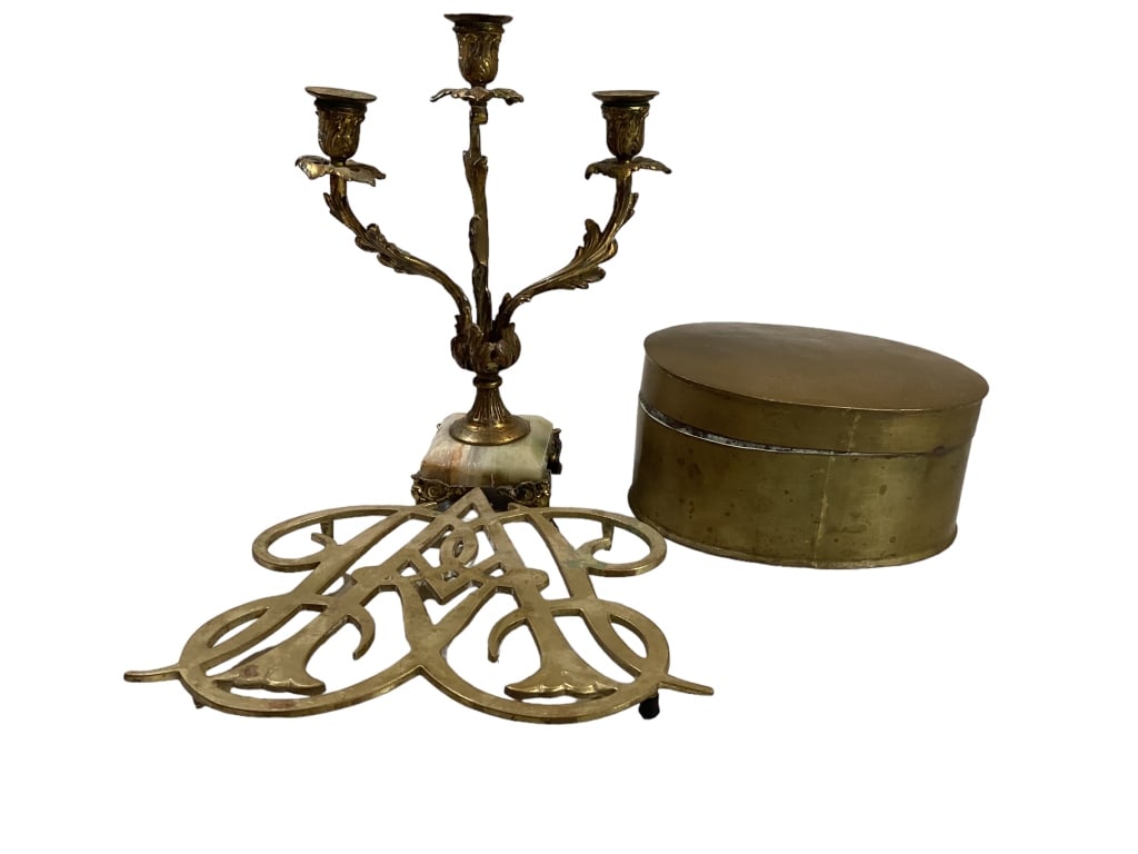 Brass Articles: Bradley and Hubbard three branch candle holder, marble platform with ornamental decoration, signed at base, #1566, large Queen Anne Cypher, Williamsburg brass trivet, 8.5 inch oval lidded box, hinged