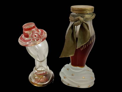 2 Vintage Novelty Perfume Bottles: 1949 Elsa Schiaparelli ZUT perfume bottle shaped as lower torso of a lady, satin glass base with stars, 5 inch bottle, has 3/4 contents. Escalate de Suzy manikin head bottle wearing red hat, with name