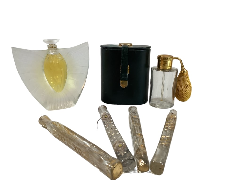 Vintage Perfumes: Four glass and enameled tear Cather perfume vials, 6.5 to 7 inches long, Lalique 2000 Sylphide nude crystal bottle, #258, Baccarat Guerlain automizer in a green leather travel case, w/ card dated 1958