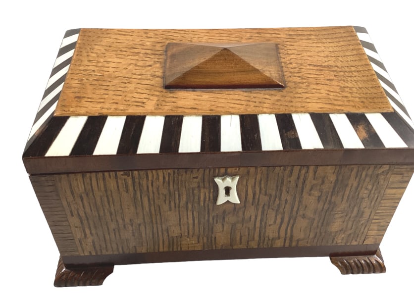 Inlaid Casket Style Music Box: 9 x 6.5 x 5 inch burl wood music box, bone key escutcheon , alternating bone inlay to lid, base key wind ( plays beautifully ). Interior 2 section tray, for trinkets or jewelry. Lid opening activates 