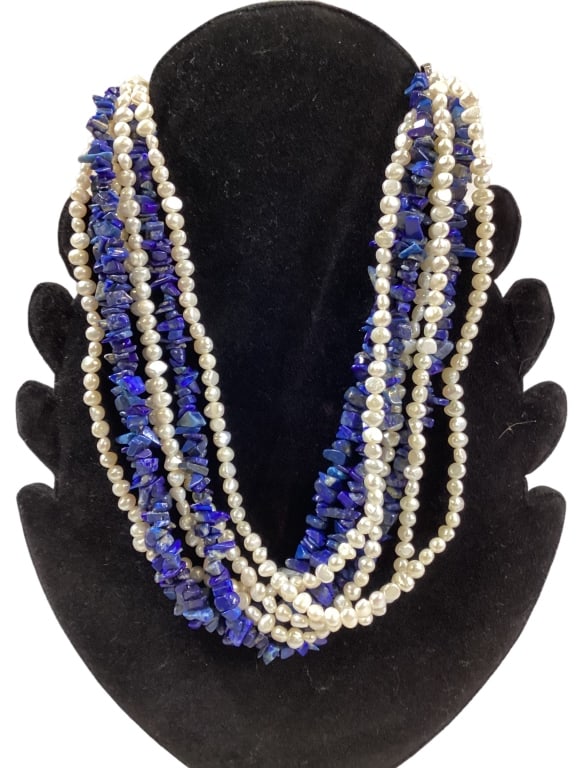 Ross and Simmons Pearl and Lapis Ncklace: 18 inch length, 7 strand combined necklace, 4 strands of fresh water pearls combined with 3 strands of lapis stones Line Item # 53