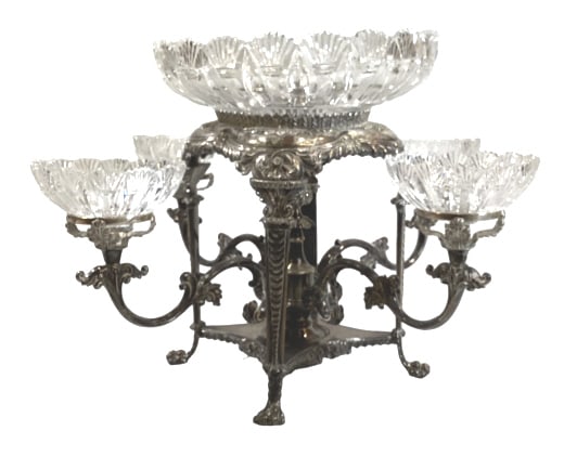 English Silver Plate and Cut Glass Epergne: Ornately decorated 5 basket epergne with arched 4 post form, 4 scrolling arms above paw feet, acanthus and floral supports, holding 5 inch cut glass bowls, with a 11 inch master bowl of matched design