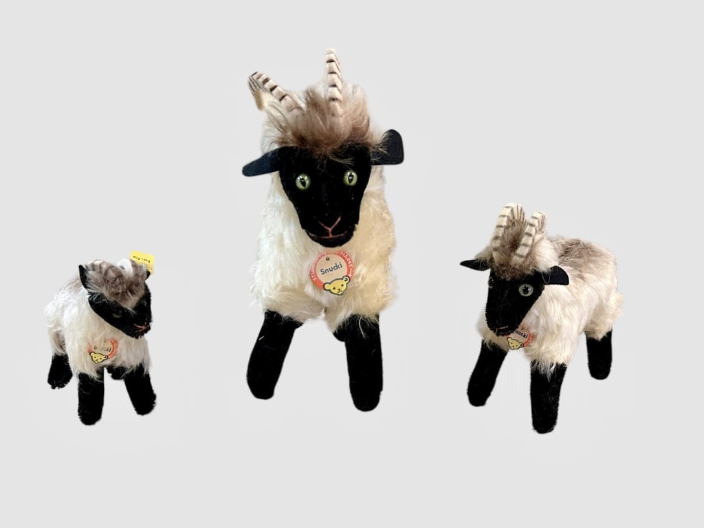 3 Steiff Snucki the Moorland Rams: Circa 1959, mohair and plush, glass eyes, pink salmon floss mouths, faint storage odor..largest with paper tag only, medium with paper tag only, smallest with all paper tag, button and yellow label 13