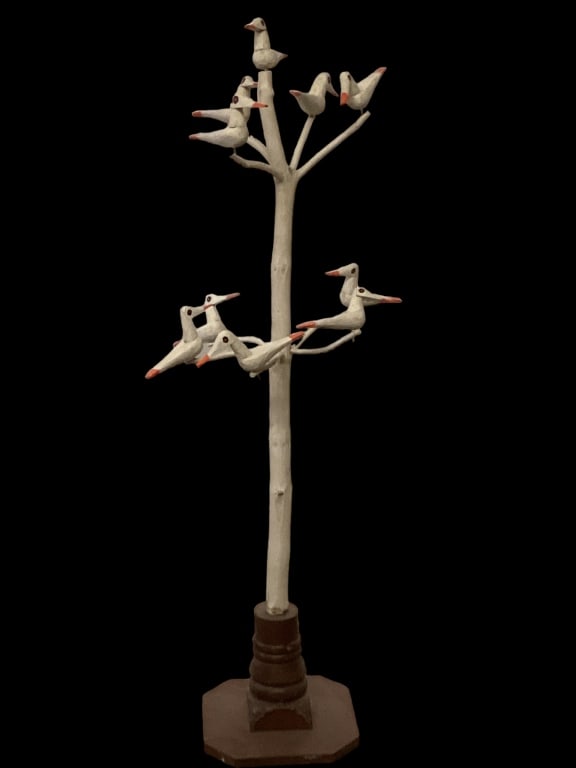 Folk Art Wooden Birds in Tree: Great folk Art carved and painted tree, 54 inches tall, with ten birds, resting on 2 levels of tree branches, white painted tree, with a shaped Newell post stand. No signature