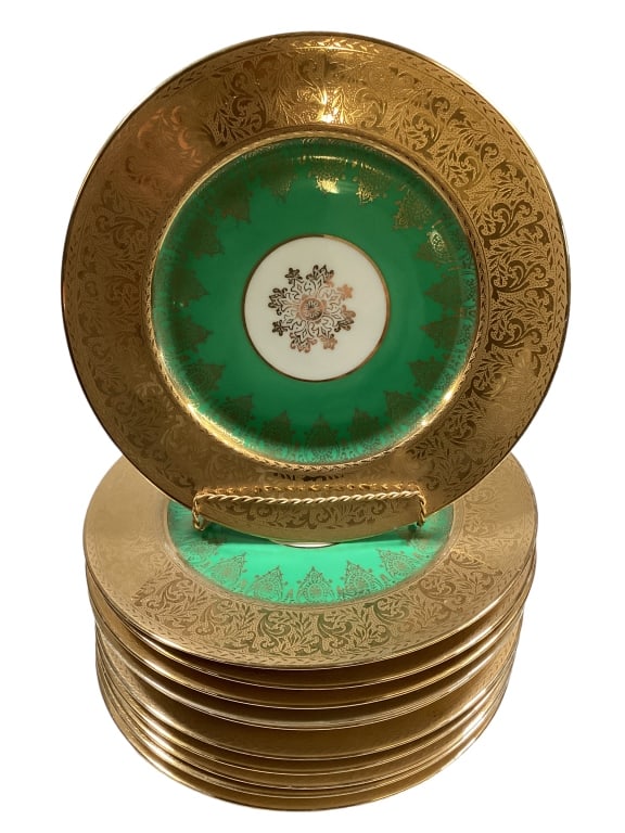 Selb Bavaria 22 K Gold Rimmed Plates: Set of 11 heavily decorated gold rimmed blades @ 10.5 inches. Heinrich and Co. with crown stamp, Warrented 22 carat gold. Light wear Line Item # 8
