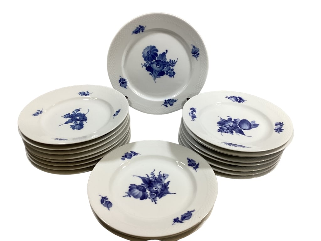 20 Pieces Royal Copenhagen China: 1 charger at 11 inches, 19 plates at 10 inches, all blue and white florals, all marked. Good condition