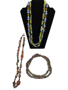 Four Stands African  Trade Beads: 30 inch strand of primitive beads with painted sections and metal separations, 34 inch graduated length of African milfiori beads, 2 strands 24 inch glass beads, Line Item # 5661997