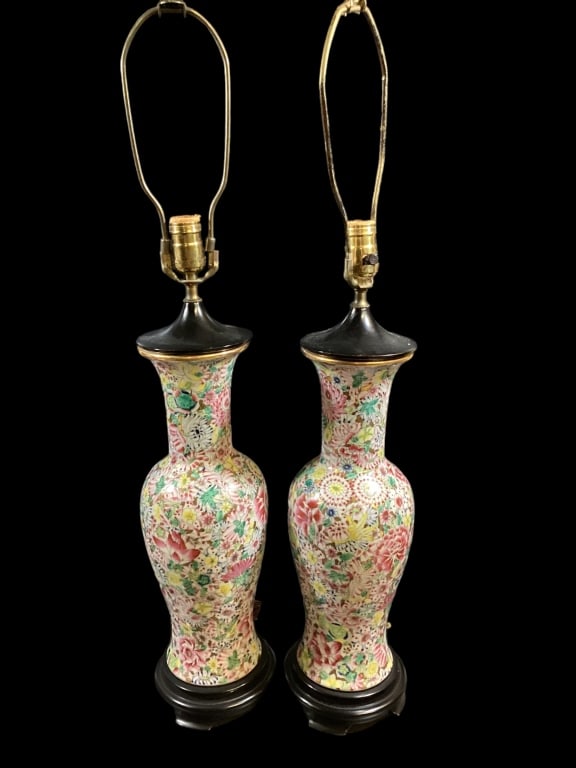 Pair Famille Porcelain Vase Lamps: Beautiful enamel decorated Baluster form vase lamps, 1000 flower style with multiple colors, lots of gilt trims. 18 inches tall to cap. Round wooden stands and caps. Originally as vases