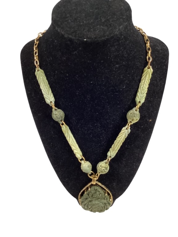 Antique Chinese Green Jade Necklace: 28 inch carved jade necklace with floral carved teardrop pendant. Jade beads with sectionals. Line Item # 37