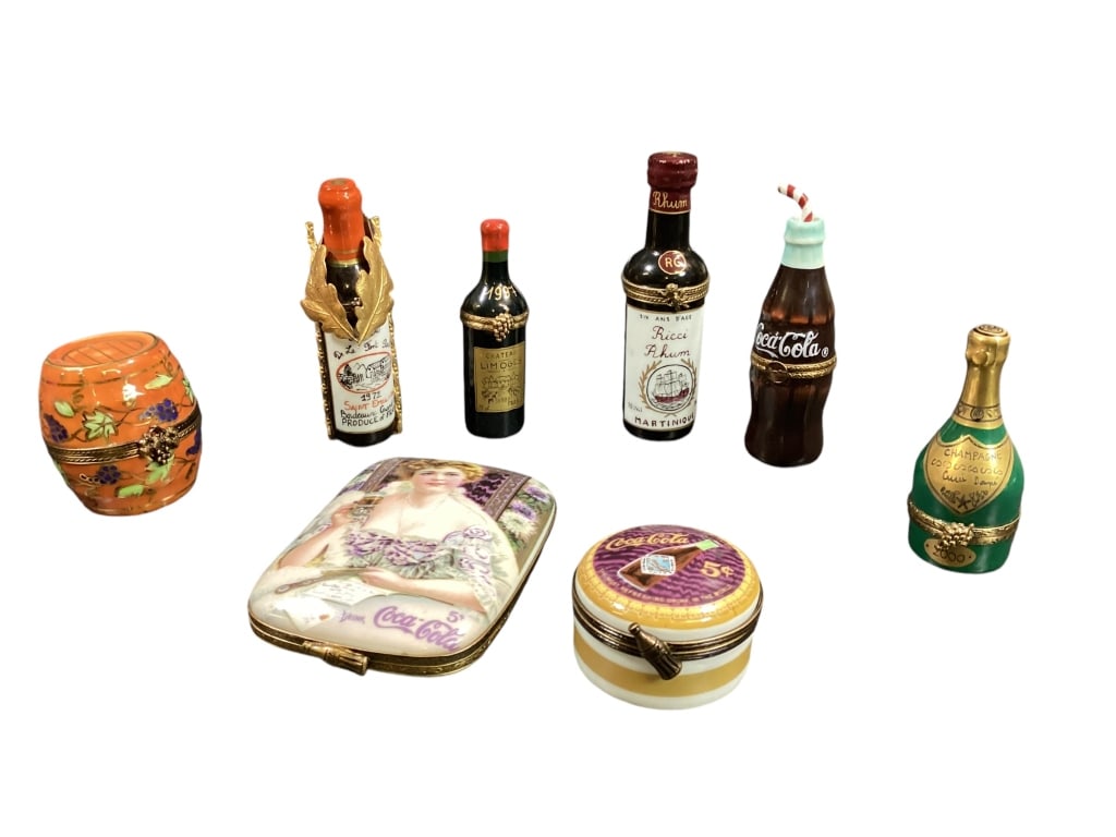 Eight Pocelain Trinket Boxes: Drink related pieces, including Coca Cola 1998 limited edition #50/1000, coke bottle, Wine Barrell, Champagne Bottle, Rhummbottle, Bordeaux France bottle with stand, 1997 wine bottle