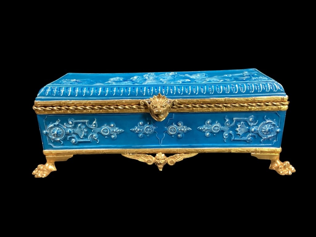 French Gilt Bronze and Porcelain Jewelry Casket: Ornate Napoleon III period casket, inset with porcelain plaques, imagery of Putti studying the arts. Gilt bronze ormolu mounting, raised on paw feet, with shaped apron. Hinged lid reveals satin lined 