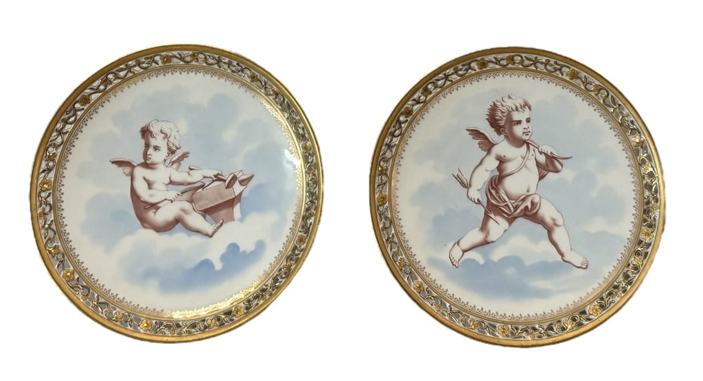 Pair 19th Century Fischer & Mieg Cabinet Plates: Two 9 inch plates with painted putto, reticulated rims, gilt decoration, back with impressed F & M mark along with crossed hammers *light surface scratches, some gilt loss, surface dirt*..also with Vi