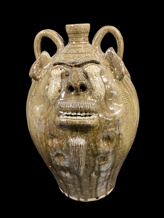 Steve Abee Ugly Face Jug: Large 20 inch jug, alkaline glazed with glaze runs, double row teeth, goatee, eyes have ran in firing, double loop handles, ring banded spout, stamped SA also signed at base